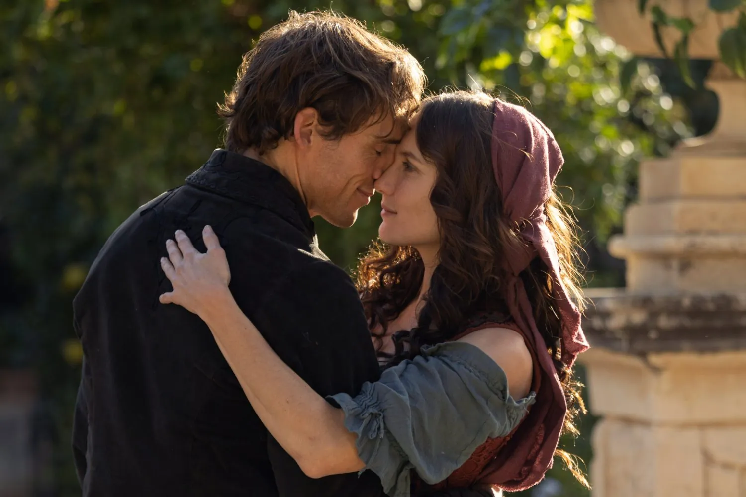 Edmund and Mercédès in a tender embrace at golden hour