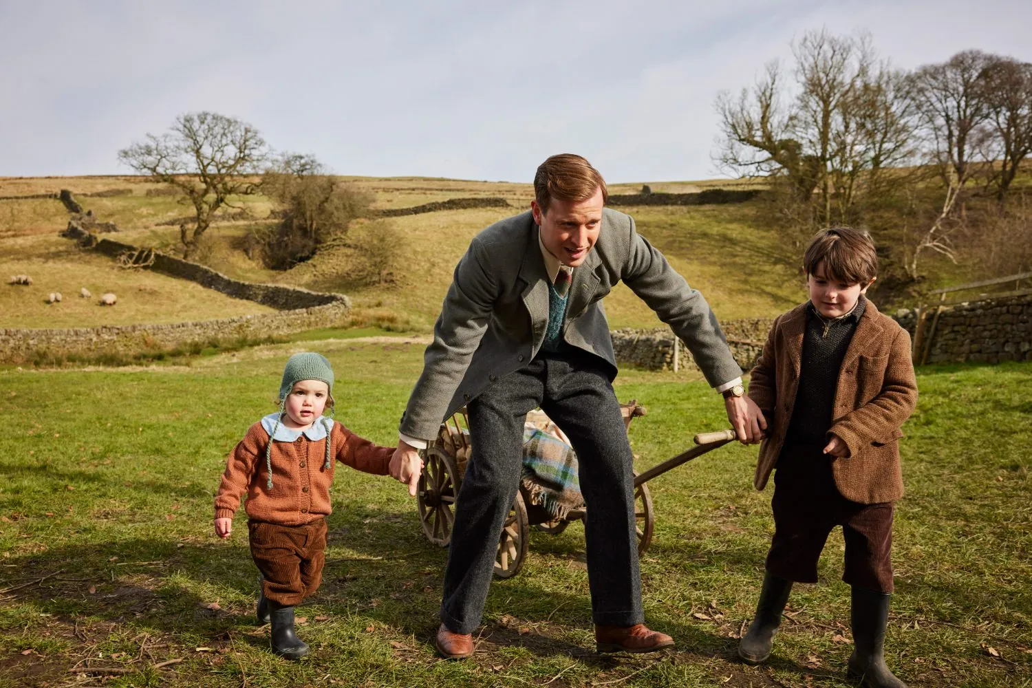 James Herriot walking with his two young children across the Yorkshire Dales